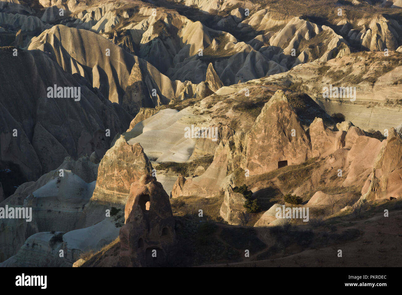 Dawn at the Kiliclar Valley, Cappadocia, Turkey.  There are a few dwellings in the rock formations visible. Stock Photo