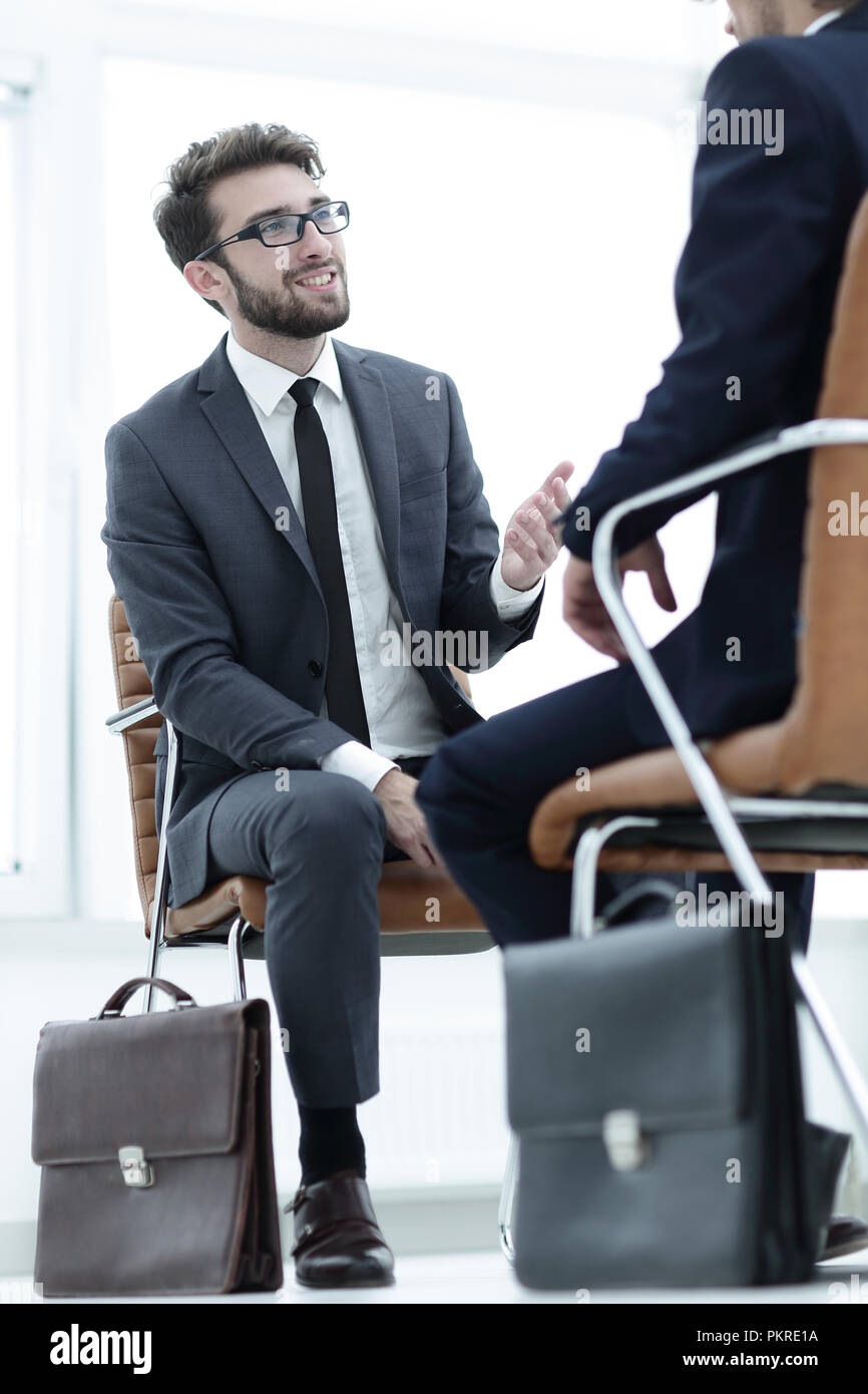 Two businessmen holding briefcases near themselves Stock Photo Alamy