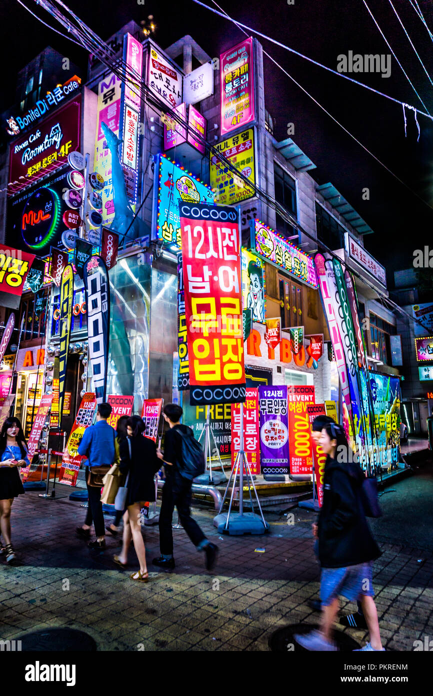 Seoul, South Korea - May 14, 2017: Big crowd of tourists and locals are shopping and walking at hongdae street market at night. The mood is fantastic. Stock Photo