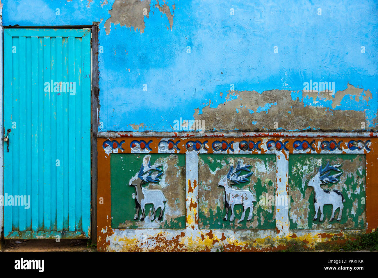 A typical old wall in Guatape, painted and decorated with "Zocalo Stock