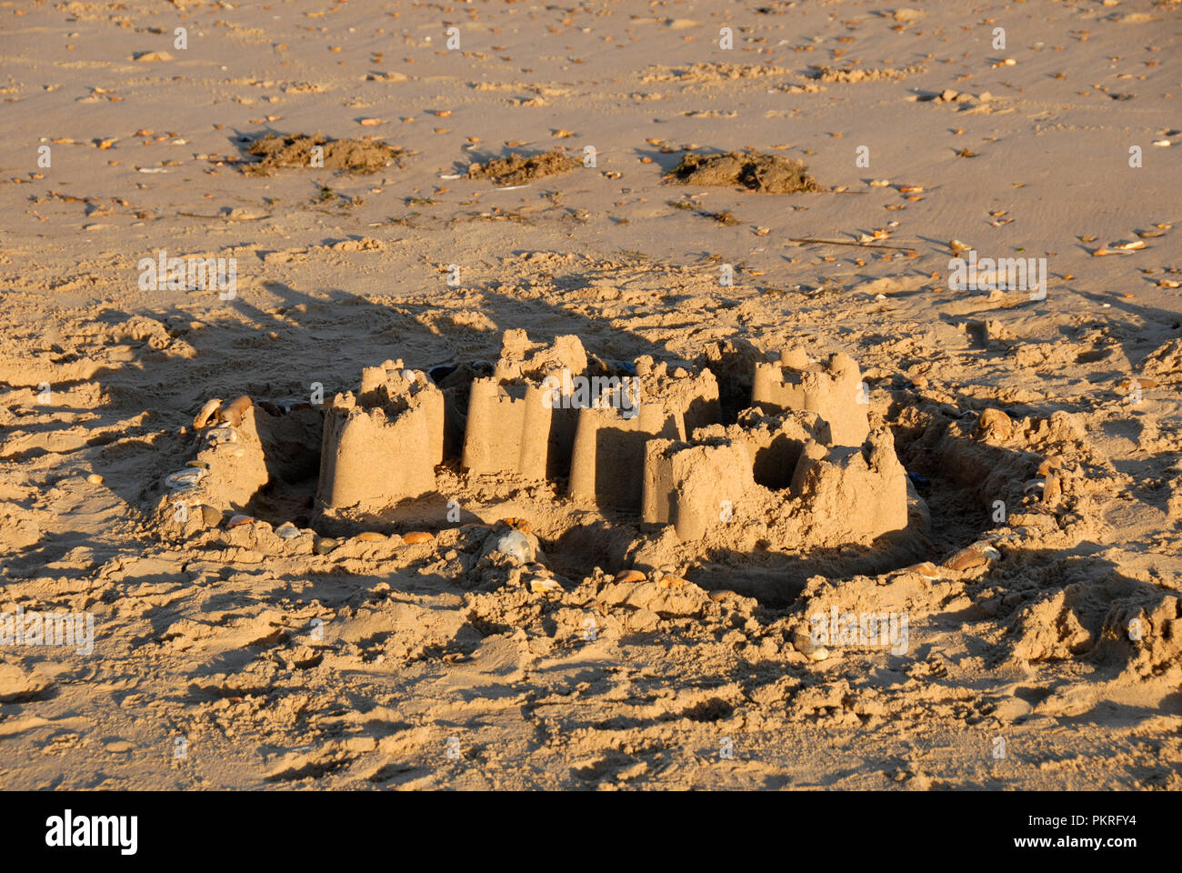 Remains of sandcastle on beach, Hunstanton, Norfolk, England Stock Photo