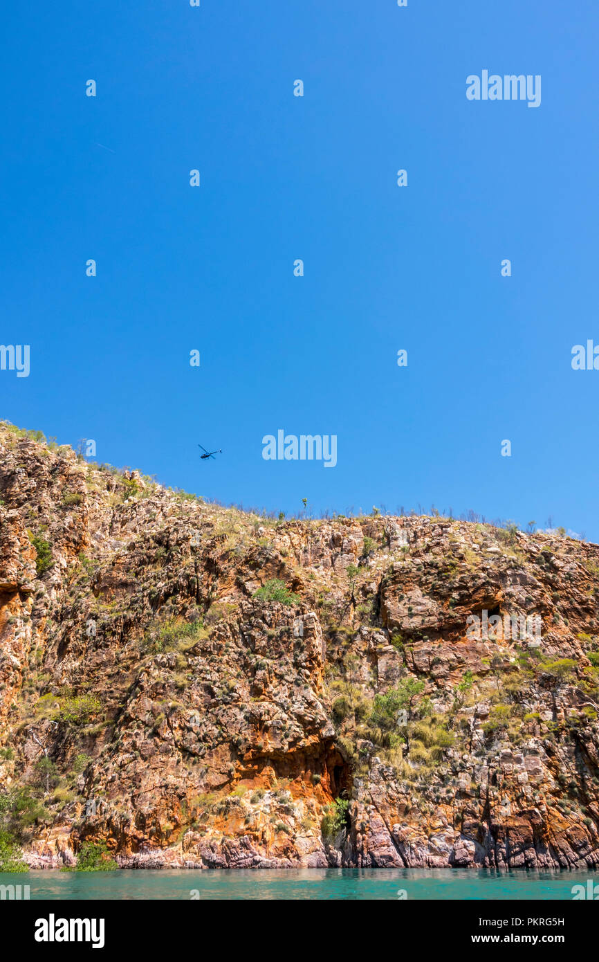 Helicopter taking tourists over Horizontal Falls, Talbot Bay, Kimberley ...