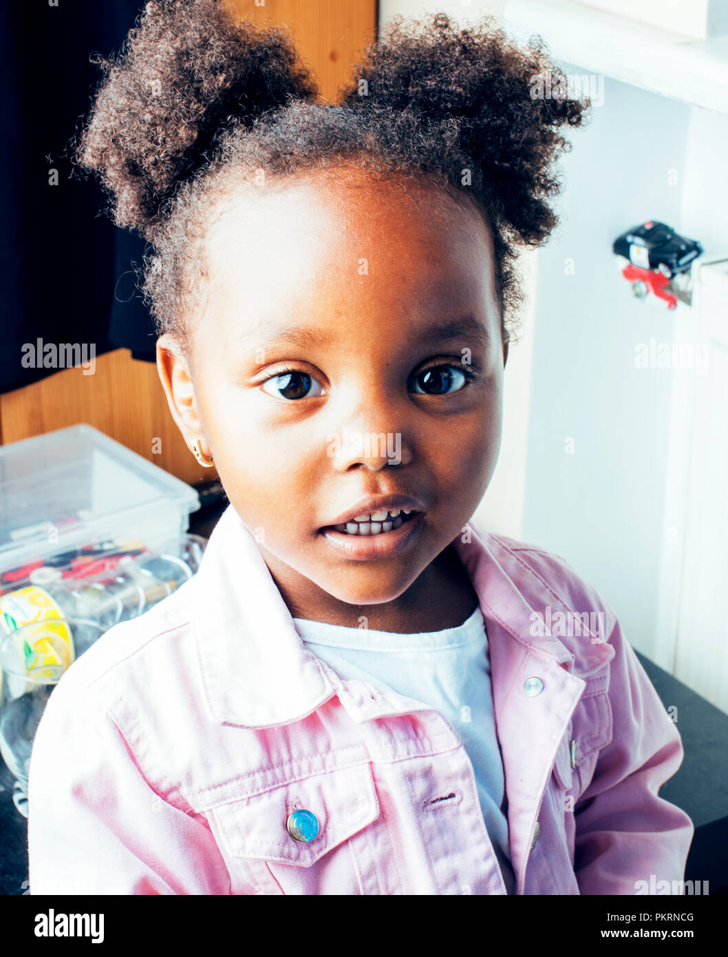 Little Cute African American Girl Playing With Animal Toys At Ho