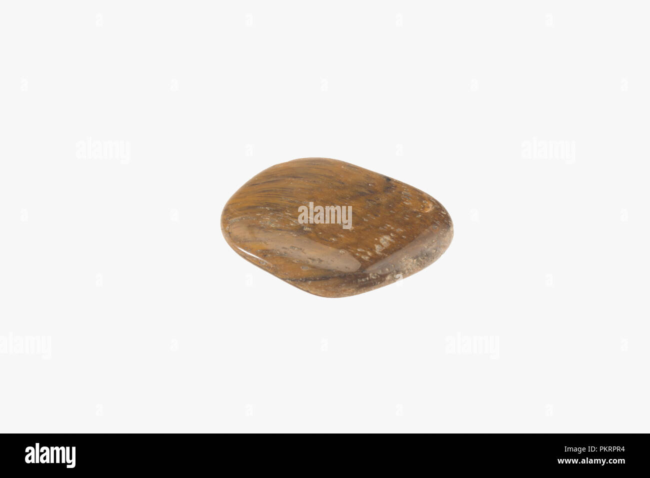 Tiger eye stone isolated. Macro shooting Stock Photo
