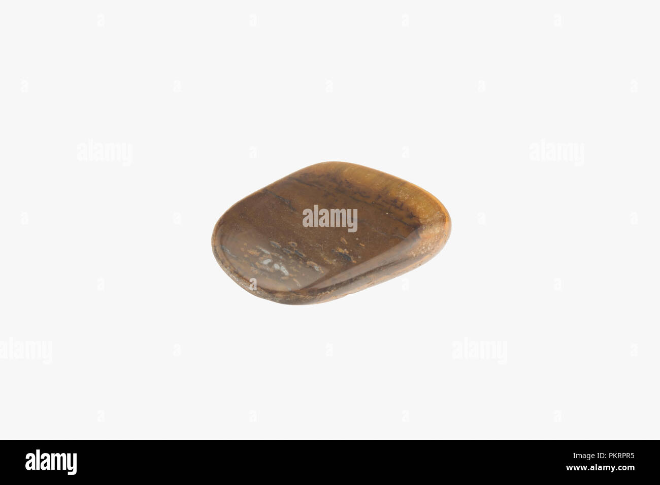 Tiger eye stone isolated. Macro shooting Stock Photo