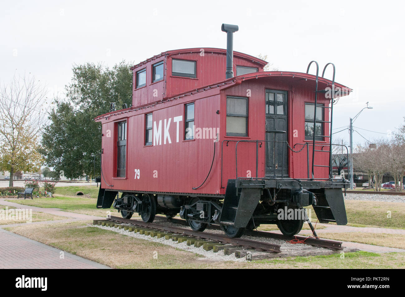 Red caboose on display in a park. Stock Photo