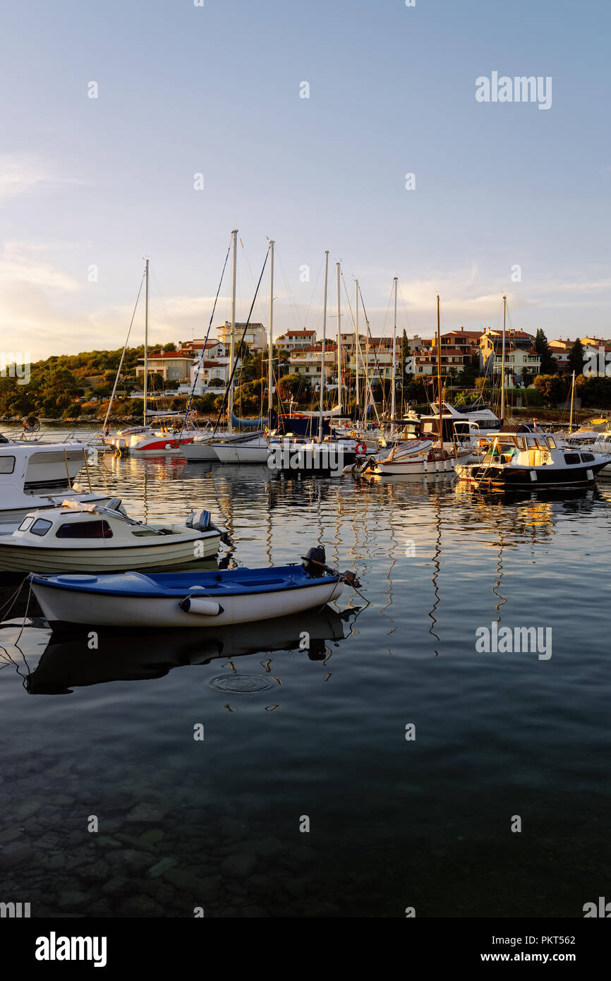 Marina with boats in Adriatic Sea in Pula, Croatia. At sunset Stock Photo