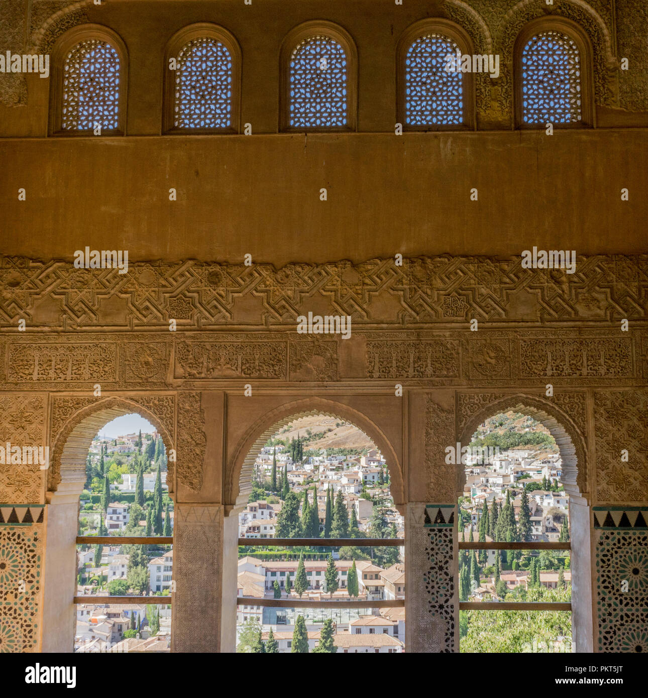 View of the Albayzin district of Granada, Spain, from a window in the Alhambra palace near sunset at Granada, Spain, Europe on a bright sunny day Stock Photo