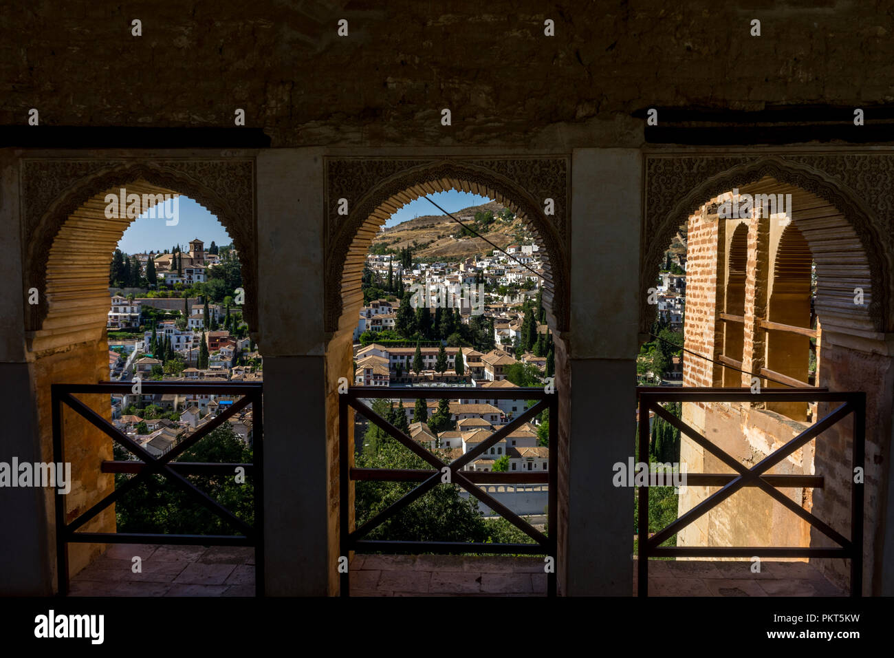 View of the Albayzin district of Granada, Spain, from a window in the Alhambra palace near sunset at Granada, Spain, Europe on a bright sunny day Stock Photo