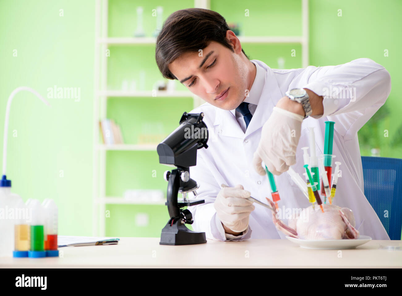Lab assistant testing GMO chicken Stock Photo Alamy