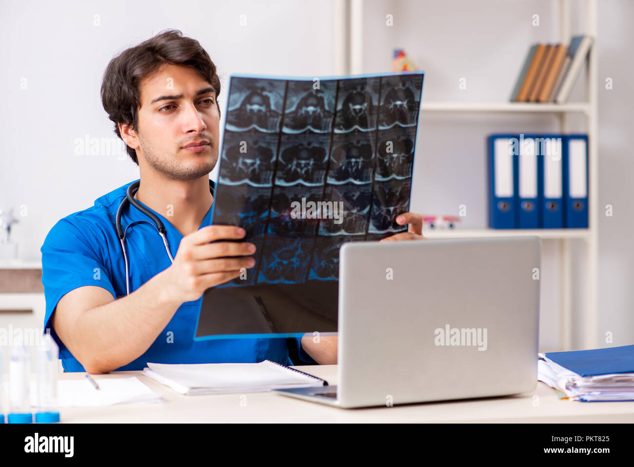 Male doctor radiologist with x-ray can image Stock Photo - Alamy