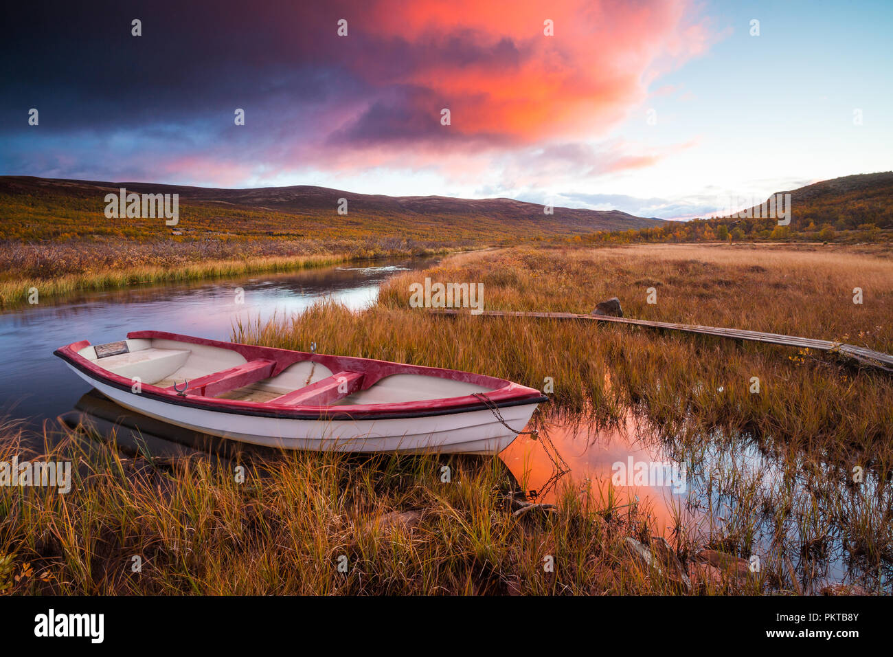 Autumn colors and sunrise at Fokstumyra nature reserve, Dovre, Norway. Stock Photo