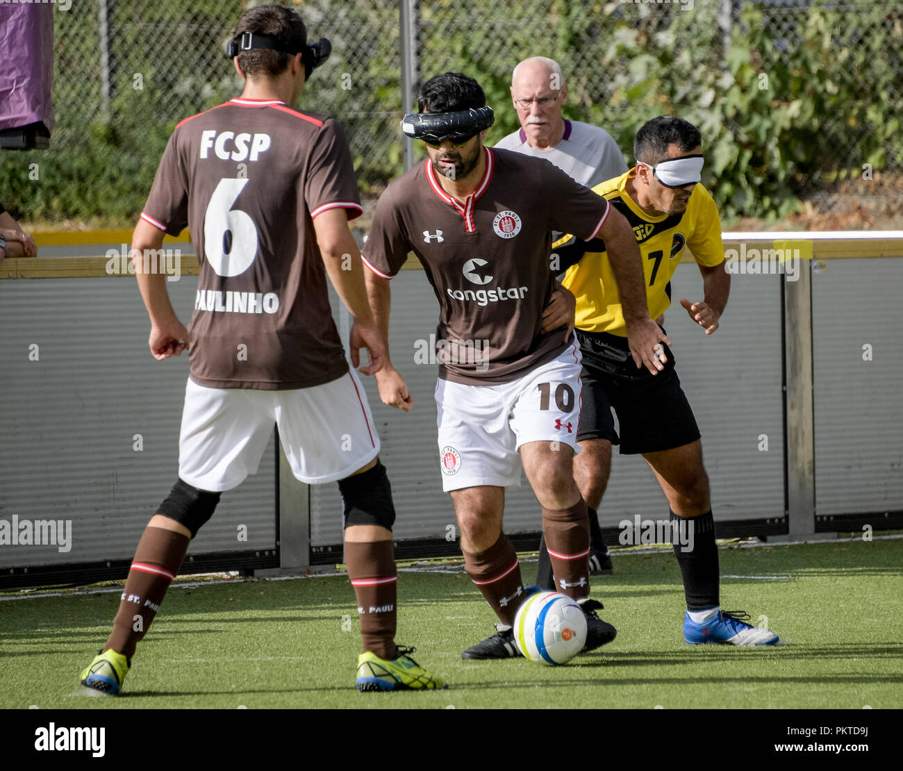 15 September 2018, Hamburg: Serdal Celebi (M), FC St. Pauli footballer for the blind, plays at the 11th Blind Football Masters on the grounds of the Bildungszentrum für Blinde und Sehbehinderte am Borgweg. Celebi is the first blind football player to be nominated for the 'Goal of the Month' of the ARD sports show. Photo: Axel Heimken/dpa Stock Photo