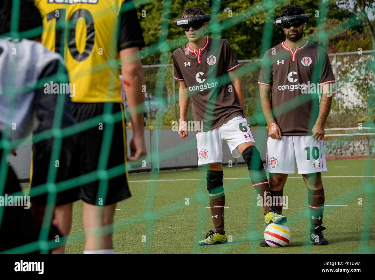 15 September 2018, Hamburg: Serdal Celebi (r), FC St. Pauli footballer for the blind, is waiting for a penalty kick at the 11th Blind Football Masters on the grounds of the Bildungszentrum für Blinde und Sehbehinderte am Borgweg. Celebi is the first blind football player to be nominated for the 'Goal of the Month' of the ARD sports show. Photo: Axel Heimken/dpa Stock Photo