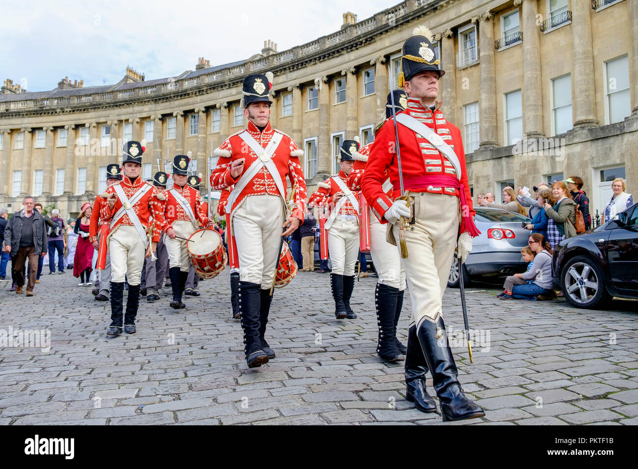 Bath, UK. 15th Sep, 2018. Members of the 33rd Regiment Of Foot are pictured marching in front of the Royal Crescent as they take part in the world famous Grand Regency Costumed Promenade. The Promenade, part of the Jane Austen Festival is a procession through the streets of Bath and the participants who come from all over the world dress in 18th Century costume. Credit:  Lynchpics/Alamy Live News Stock Photo