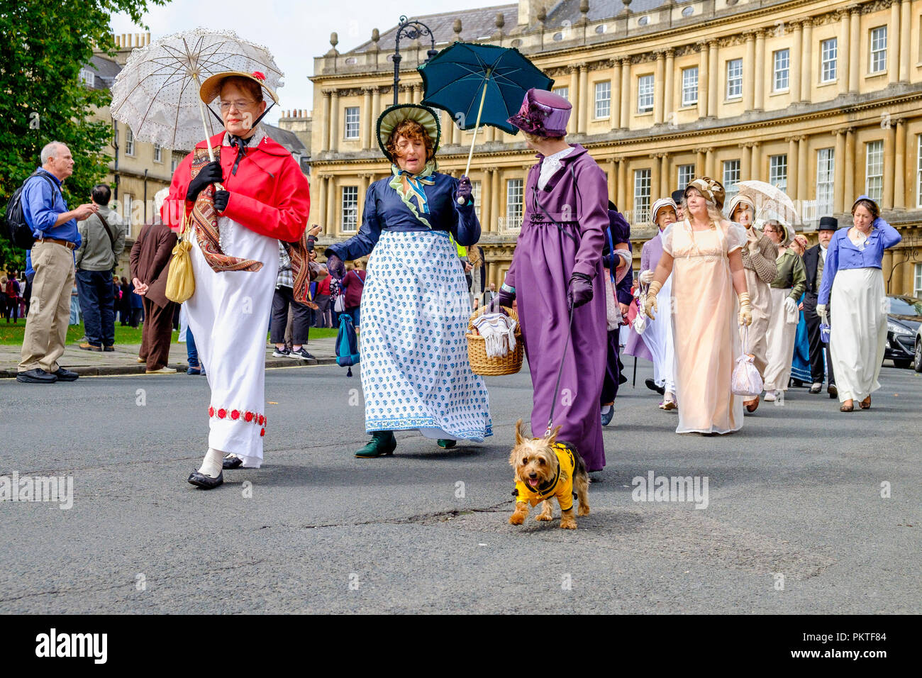 Bath, UK. 15th Sep, 2018. Jane Austen fans taking part in the world-famous Grand Regency Costumed Promenade are pictured as they walk around the Circus. The Promenade, part of the Jane Austen Festival is a procession through the streets of Bath and the participants who come from all over the world and dress in 18th Century costume. Credit:  Lynchpics/Alamy Live News Stock Photo
