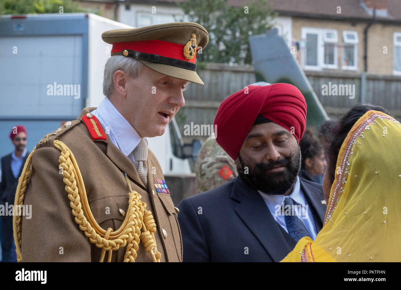 London 15th September 2018 UK Army open day to mark annual Saragarhi Commemorations This celebrates an epic battle where 21 Sikh soldiers took a last stand against 10,000 enemy tribesmen in 1897  Major General Ben Bathurst CBE General officer commanding London District, talks to some local sikhs at the event Credit Ian Davidson/Alamy Live News Stock Photo