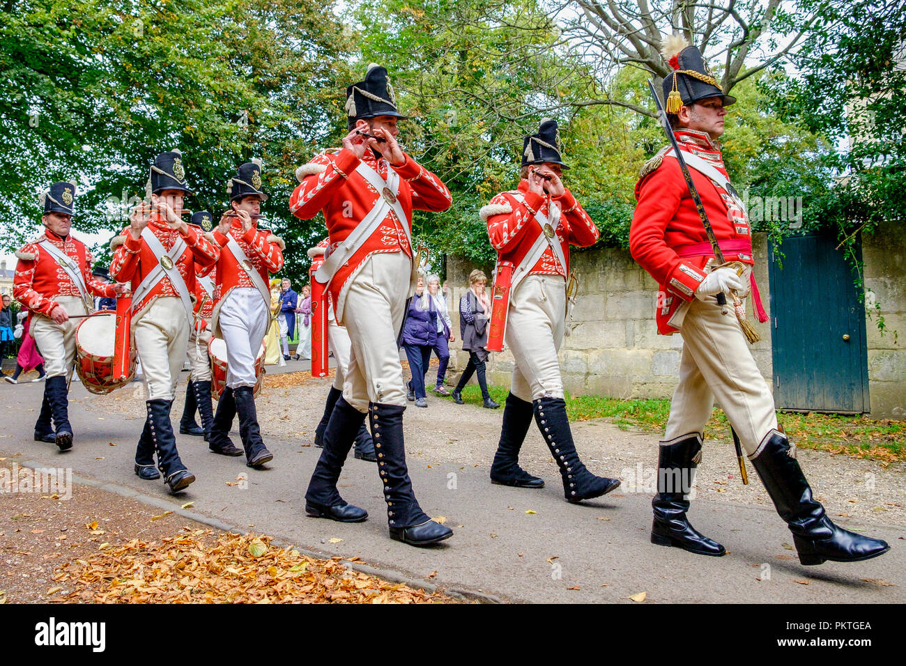 Bath, UK. 15th Sep, 2018. Members of the 33rd Regiment Of Foot are pictured marching through Royal Victoria Park as they take part in the world famous Grand Regency Costumed Promenade. The Promenade, part of the Jane Austen Festival is a procession through the streets of Bath and the participants who come from all over the world dress in 18th Century costume. Credit:  Lynchpics/Alamy Live News Stock Photo
