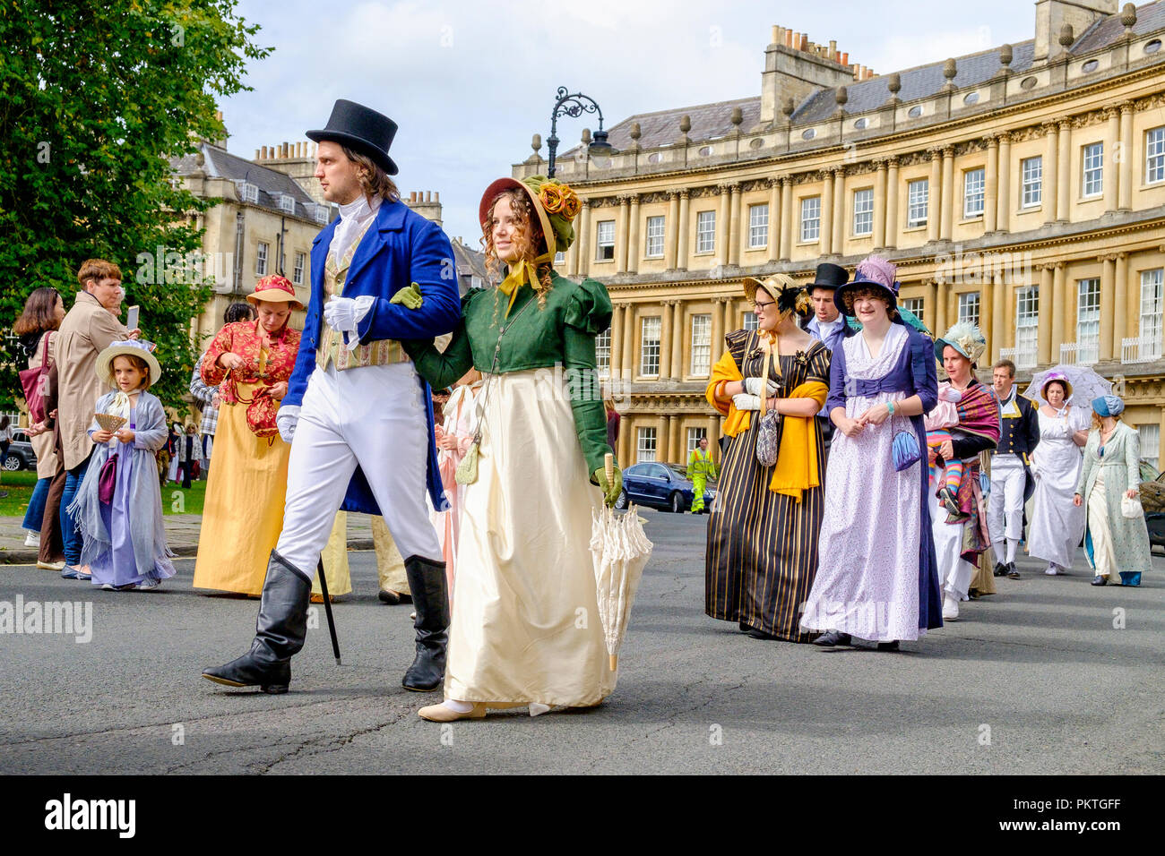 Bath, UK. 15th Sep, 2018. Jane Austen fans taking part in the world-famous Grand Regency Costumed Promenade are pictured as they walk around the Circus. The Promenade, part of the Jane Austen Festival is a procession through the streets of Bath and the participants who come from all over the world and dress in 18th Century costume. Credit:  Lynchpics/Alamy Live News Stock Photo