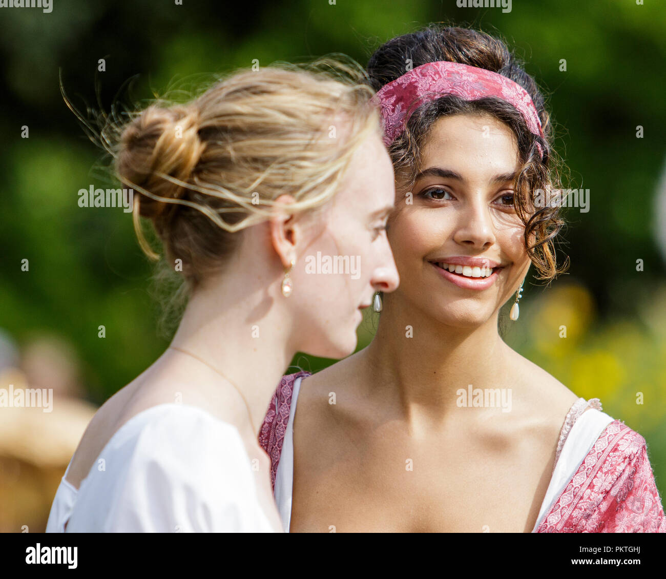 Bath, UK. 15th Sep, 2018. Jane Austen fans taking part in the world famous Grand Regency Costumed Promenade are pictured in Parade Gardens. The Promenade, part of the Jane Austen Festival is a procession through the streets of Bath and the participants who come from all over the world dress in 18th Century costume. Credit:  Lynchpics/Alamy Live News Stock Photo