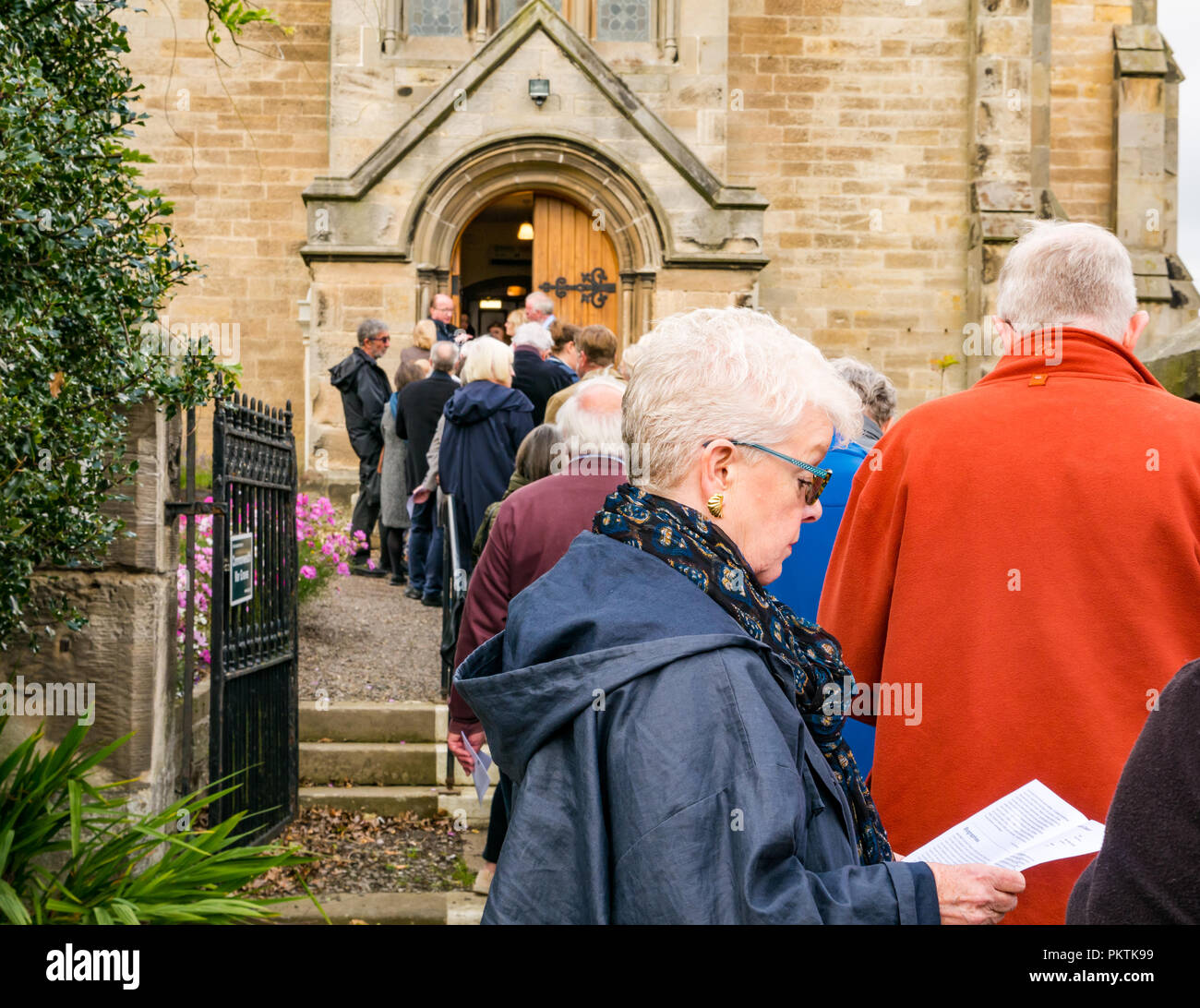 Gladsmuir Parish Church, Gladsmuir, East Lothian, Scotland, UK, 15th September 2018. A concert at the Lammermuir Festival in Gladsmuir. People queue to get into the concert and buy programmes Stock Photo