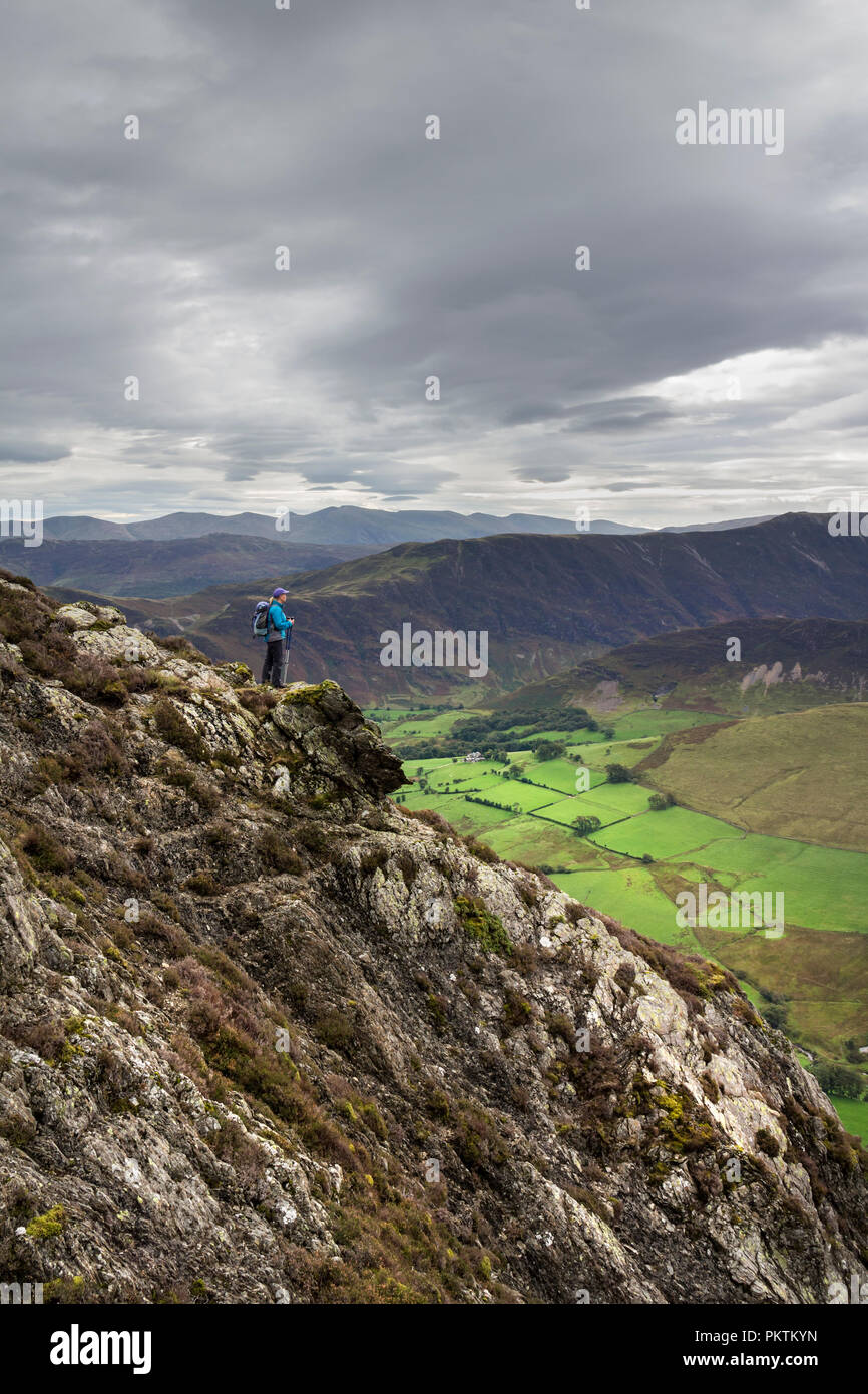 Lake District, Cumbria, Saturday 15th September 2018. UK Weather.  After a dull start to the day a walker enjoys a spectacular view over the Newlands Valley from the mountain of Ard Crags as the weather begins to clear in the Lake District. David Forster/Alamy Live News Stock Photo