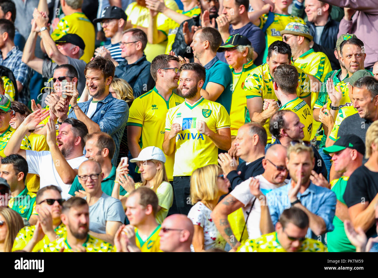 Carrow Road, Norfolk, UK. 15th Sep 2018. Sky Bet EFL Championship Norwich City v Middlesbrough ;  Norwich fans celebrate their victory over Middlesborough.    EDITORIAL USE ONLY No use with unauthorised audio, video, data, fixture lists, club/league logos or 'live' services. No use in betting, games or single club/league/player publications and all English Football League images are subject to DataCo Licence Credit: News Images /Alamy Live News Stock Photo