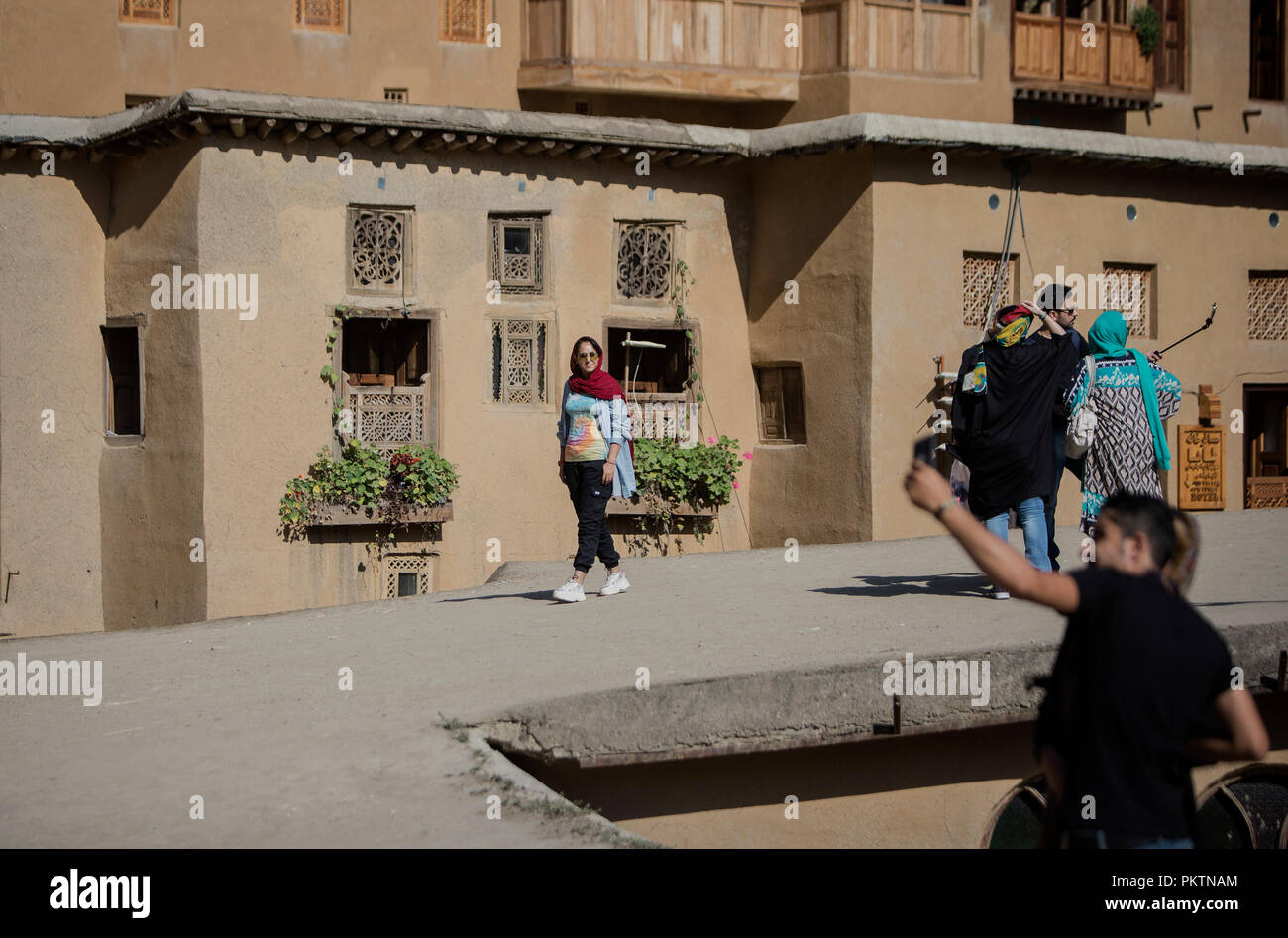 Masouleh, Iran. 14th Sep, 2018. Tourists visit Masouleh, northern Iran, on Sept. 14, 2018. The historical town of Masouleh, famous for its interconnected buildings and courtyards and roofs serving as pedestrian areas similar to streets, has an attractive nature and architecture with an antiquity of more than 1,000 years. Credit: Ahmad Halabisaz/Xinhua/Alamy Live News Stock Photo