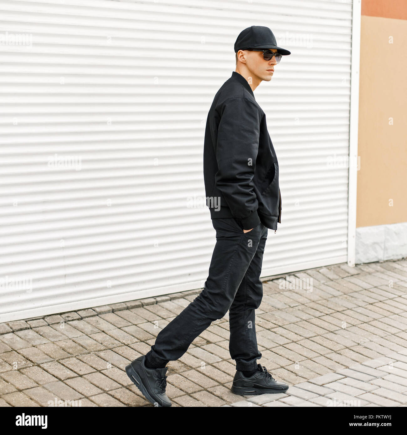 black baseball cap, fashionable jacket 