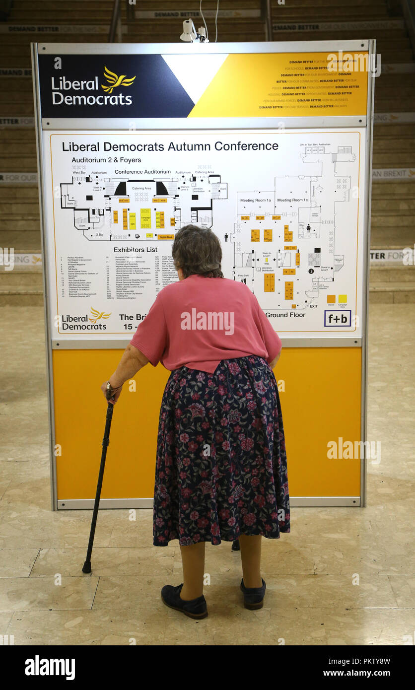 A delegate arrives at the Liberal Democrats Autumn Conference at the Brighton Centre in Brighton. Stock Photo