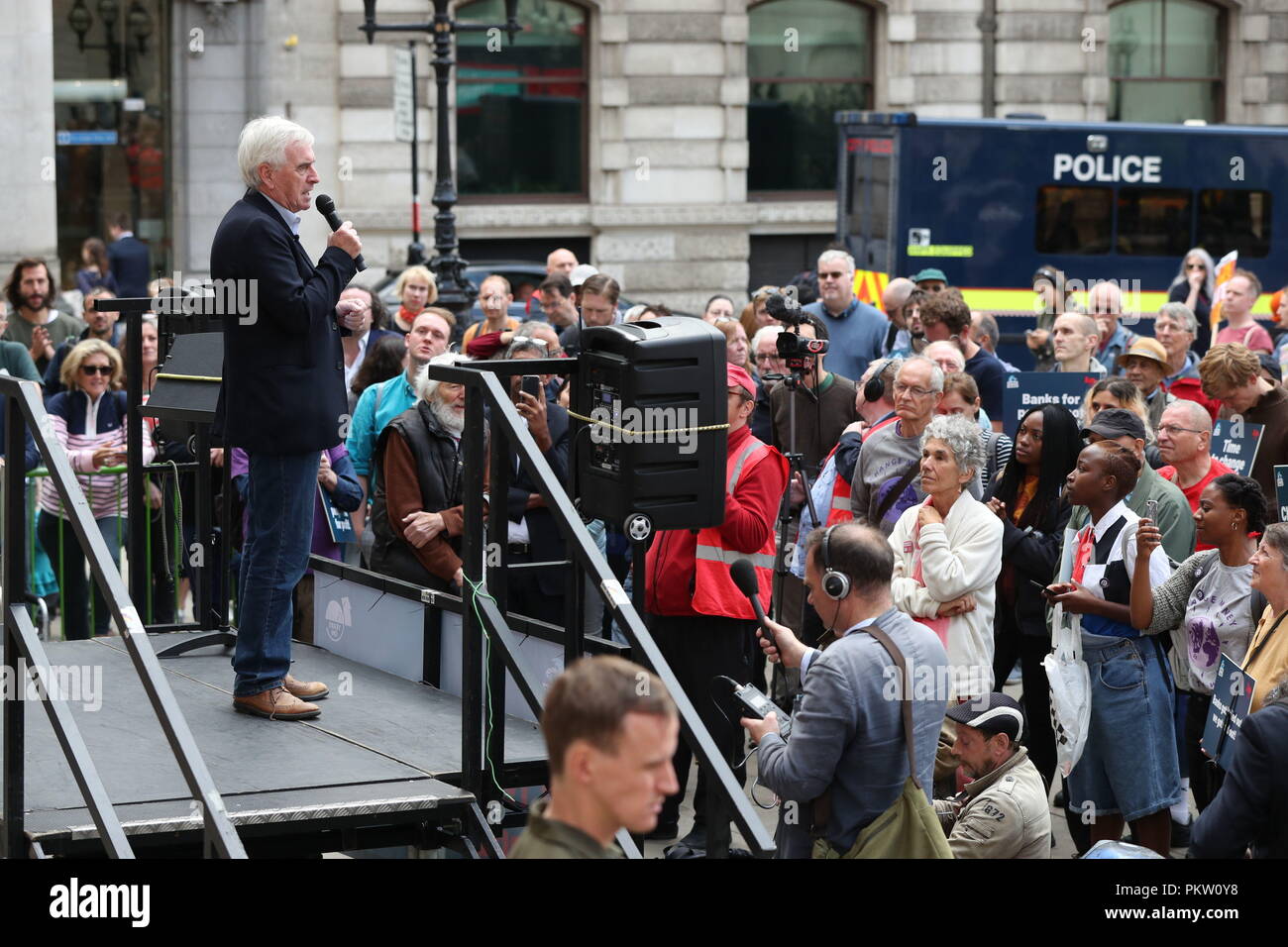 Shadow Chancellor John McDonnell speaking at a rally to mark the 10th anniversary of the collapse of Lehman Brothers and the financial crisis, outside the Royal Exchange building in the City of London. Stock Photo