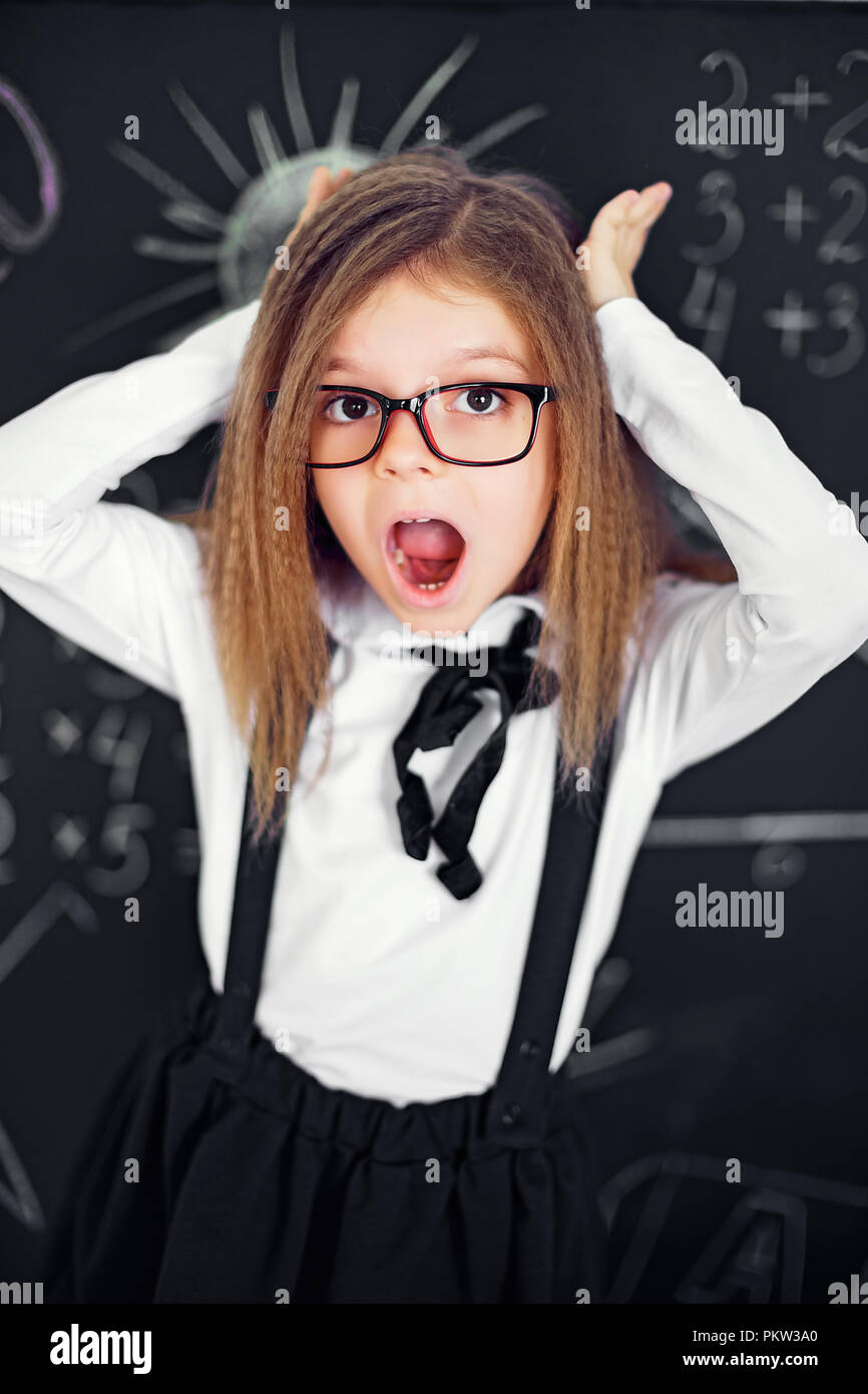 funny crazy girl student with glasses in classroom Stock Photo Alamy