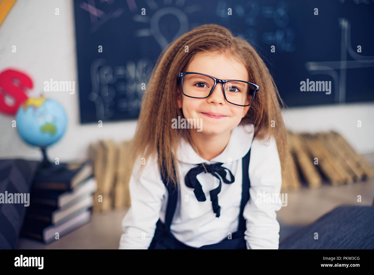 funny crazy girl student with glasses in classroom Stock Photo Alamy