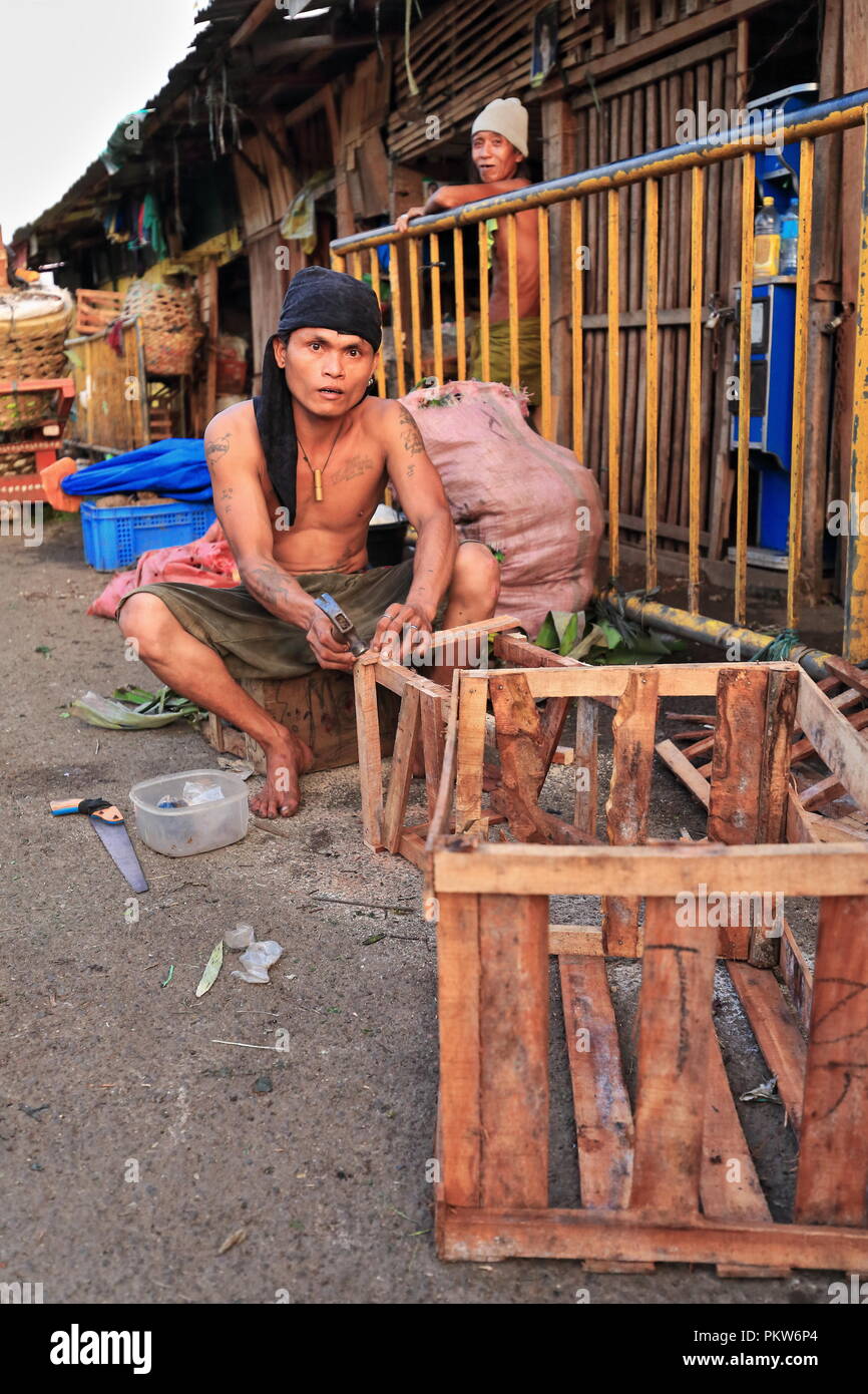 Cebu, PhilippinesOctober 18, 2016 Man makes wooden boxes for