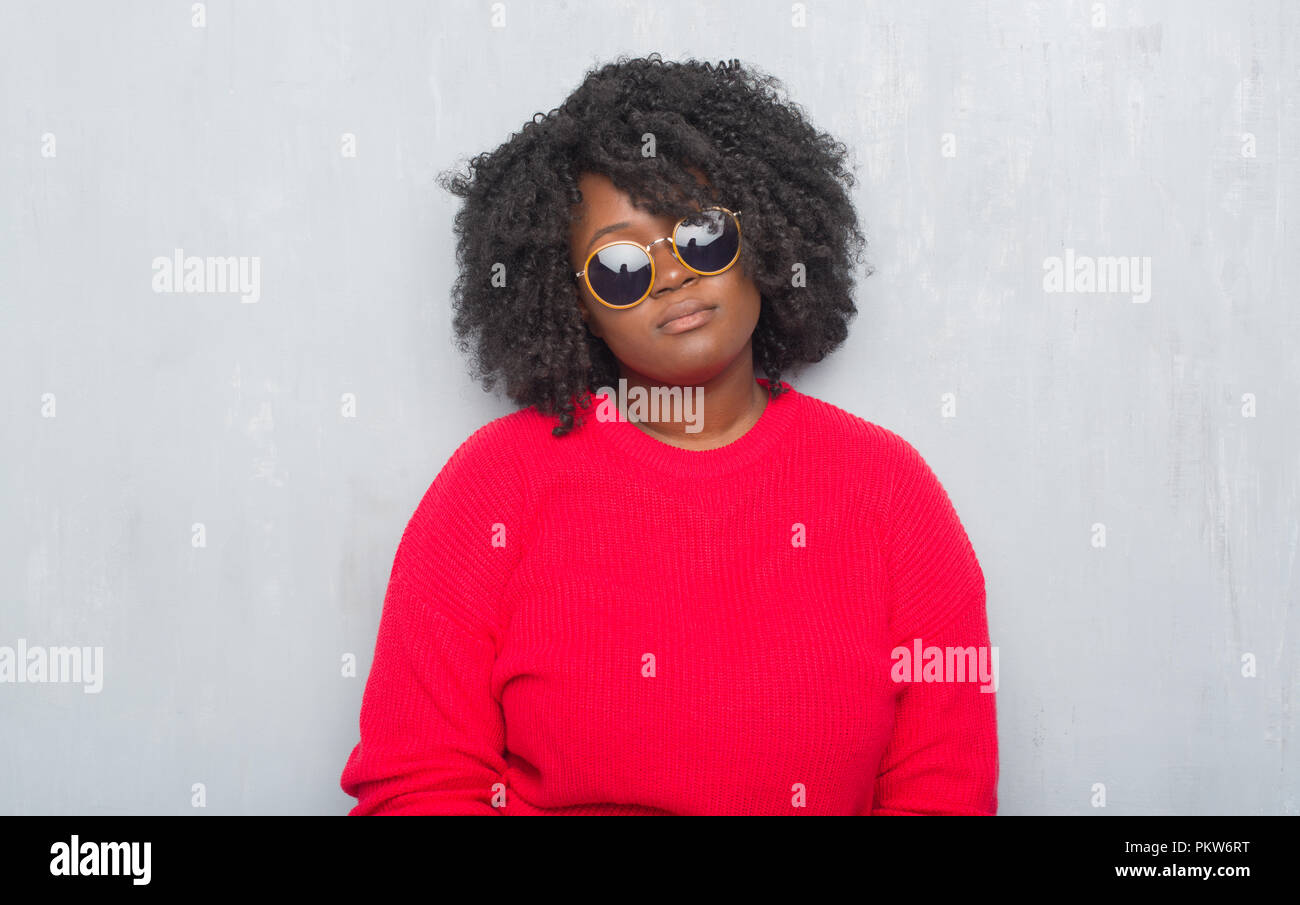 Young African American Plus Size Woman Over Grey Grunge Wall
