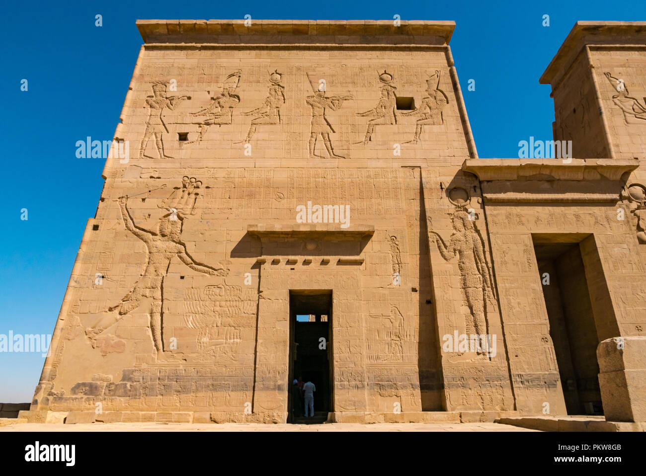 Outer pylon with carved Egyptian figures and hieroglyphs, Temple of Philae, Agilkia Island, River Nile, Aswan, Egypt, Africa Stock Photo