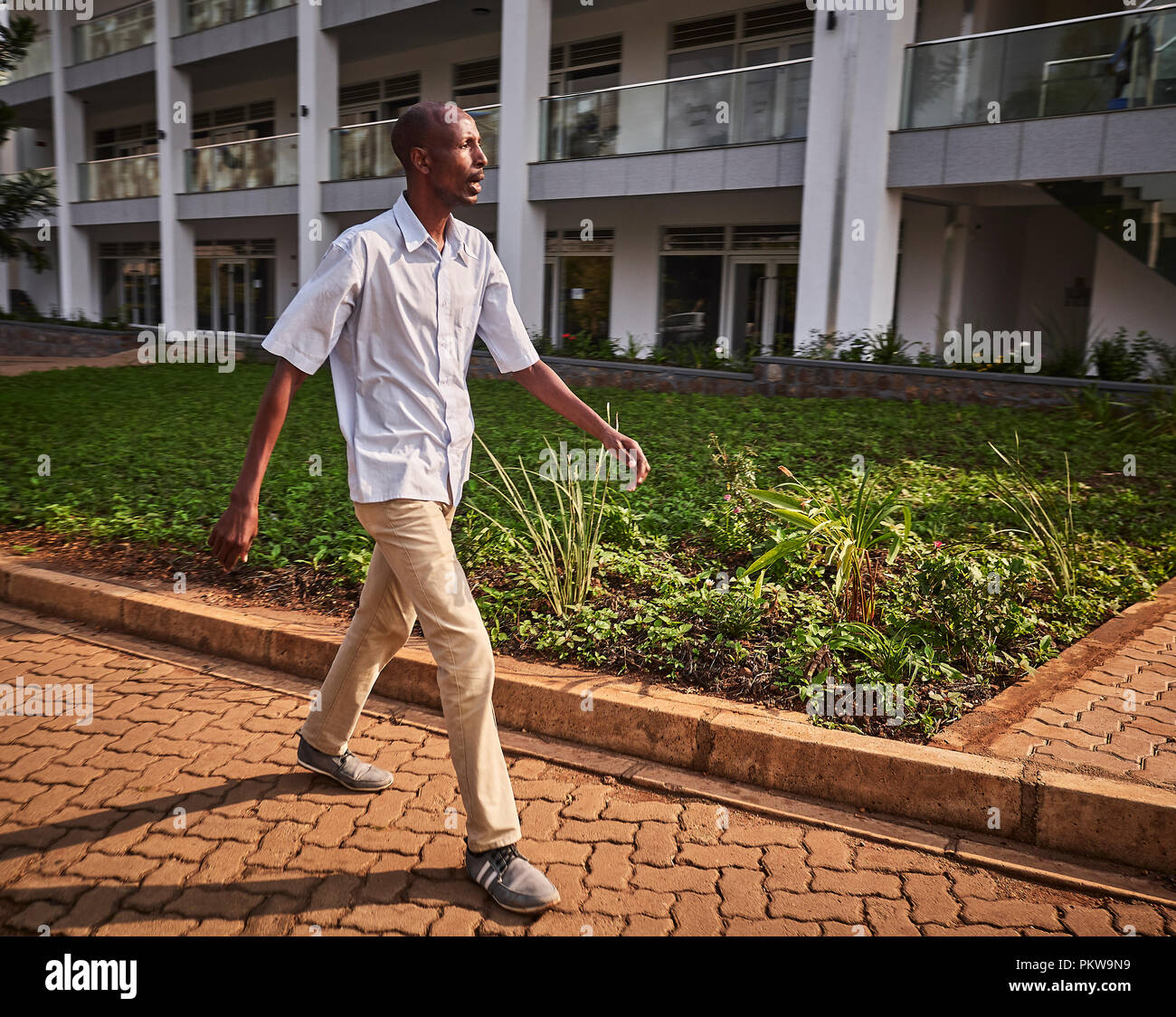 shirt and sneekers walking fast in Kigali, Rwanda Stock Photo