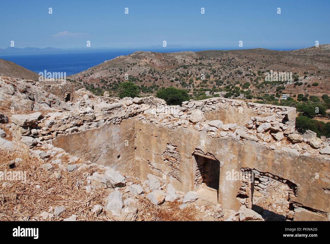 The ruins of the abandoned village of Mikro Chorio on the Greek island of Tilos. Stock Photo