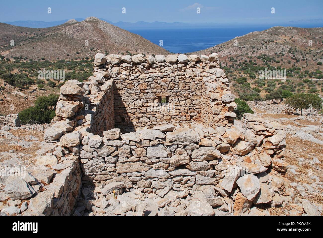 The ruins of the abandoned village of Mikro Chorio on the Greek island of Tilos. Stock Photo