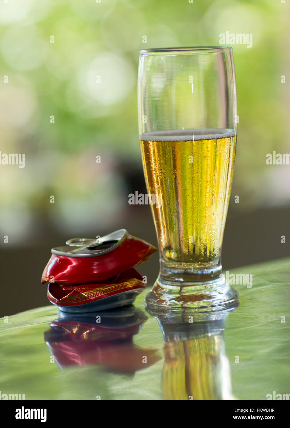 Alcoholic beverage. Glass of beer and metal cans Stock Photo Alamy