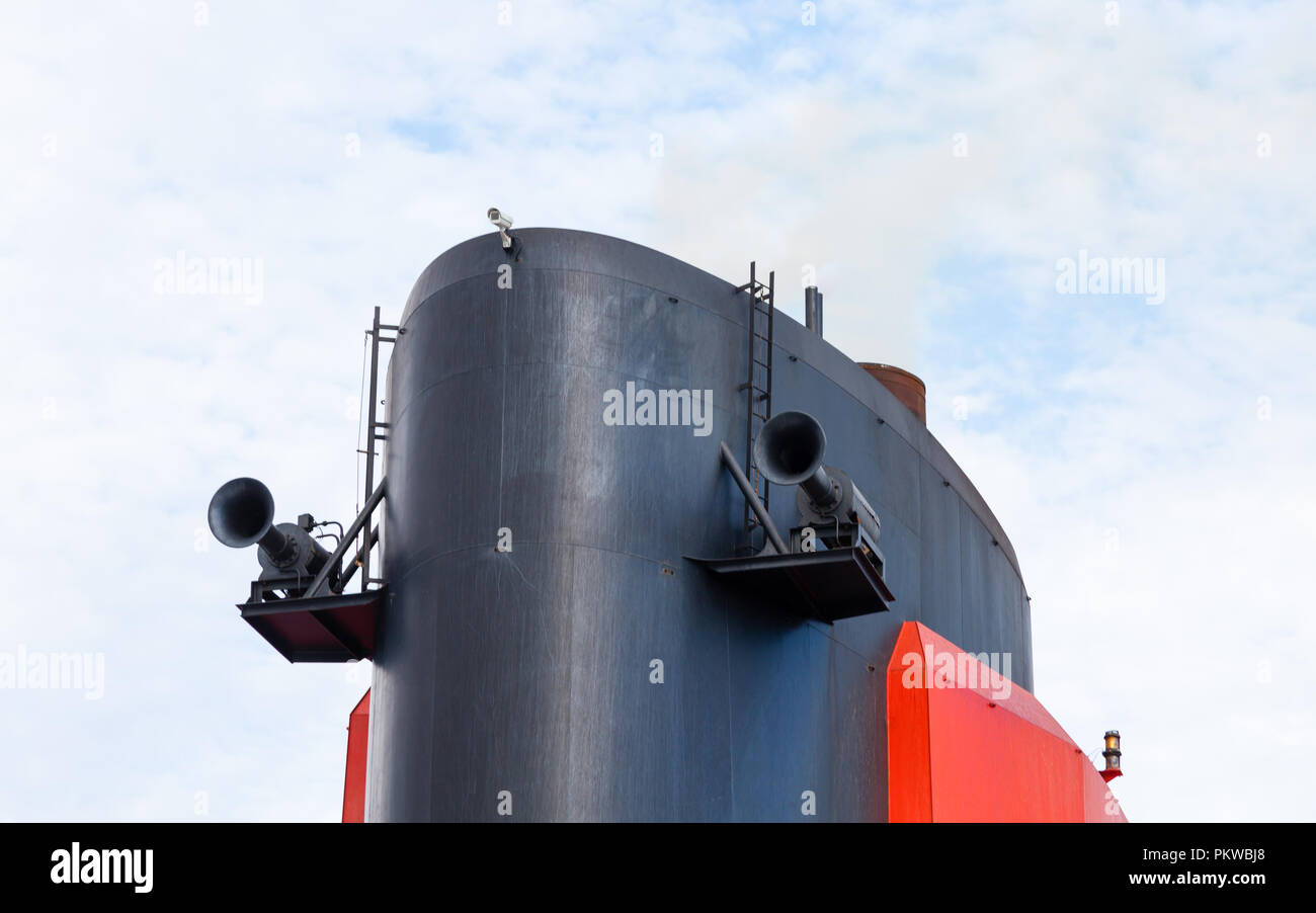 A close up view of the funnel of Cunard cruise liner Queen Mary 2.  Cunard Line is part of the Carnival Corporation. Stock Photo