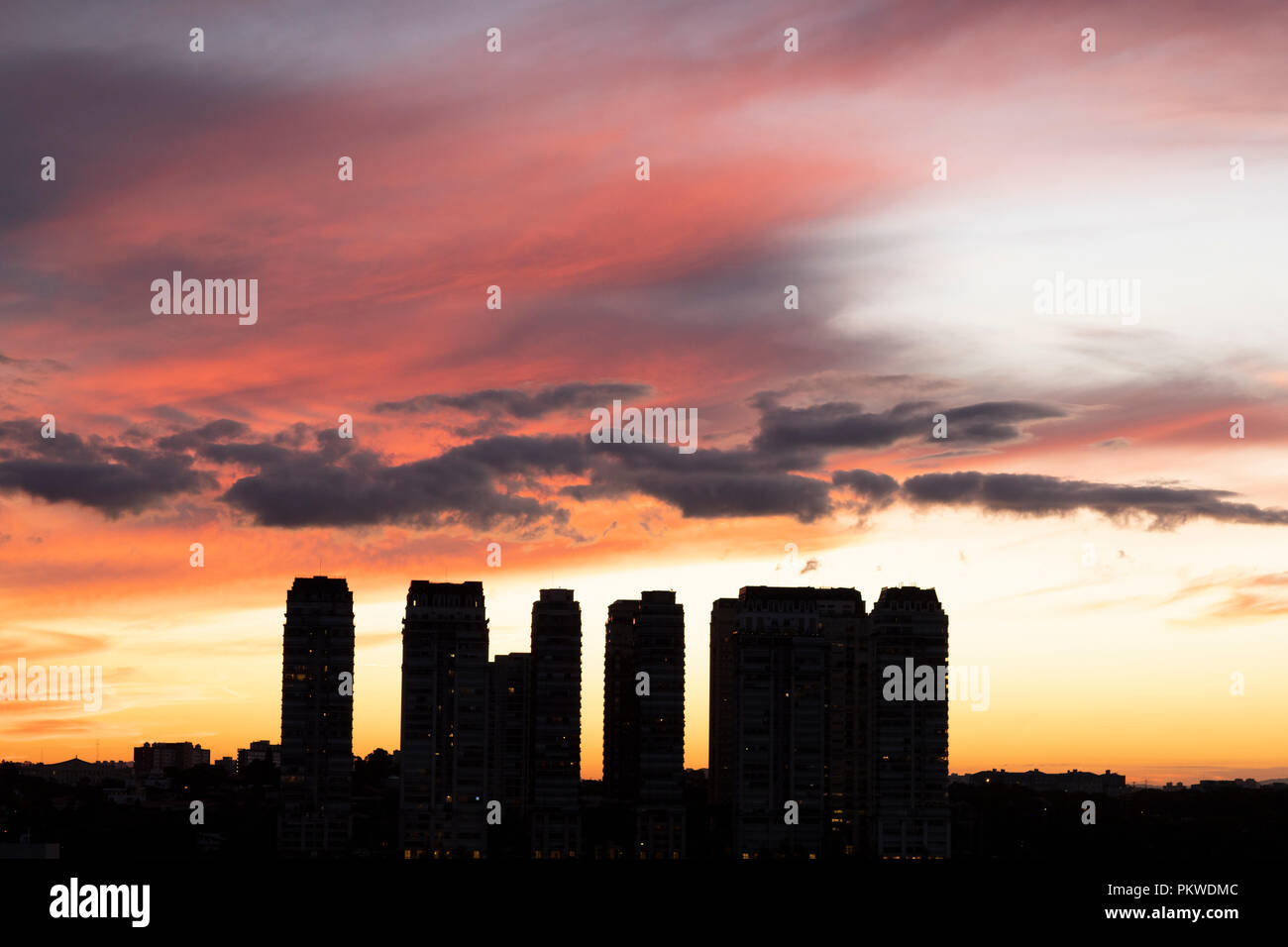 Sunrise between buildings Stock Photo - Alamy
