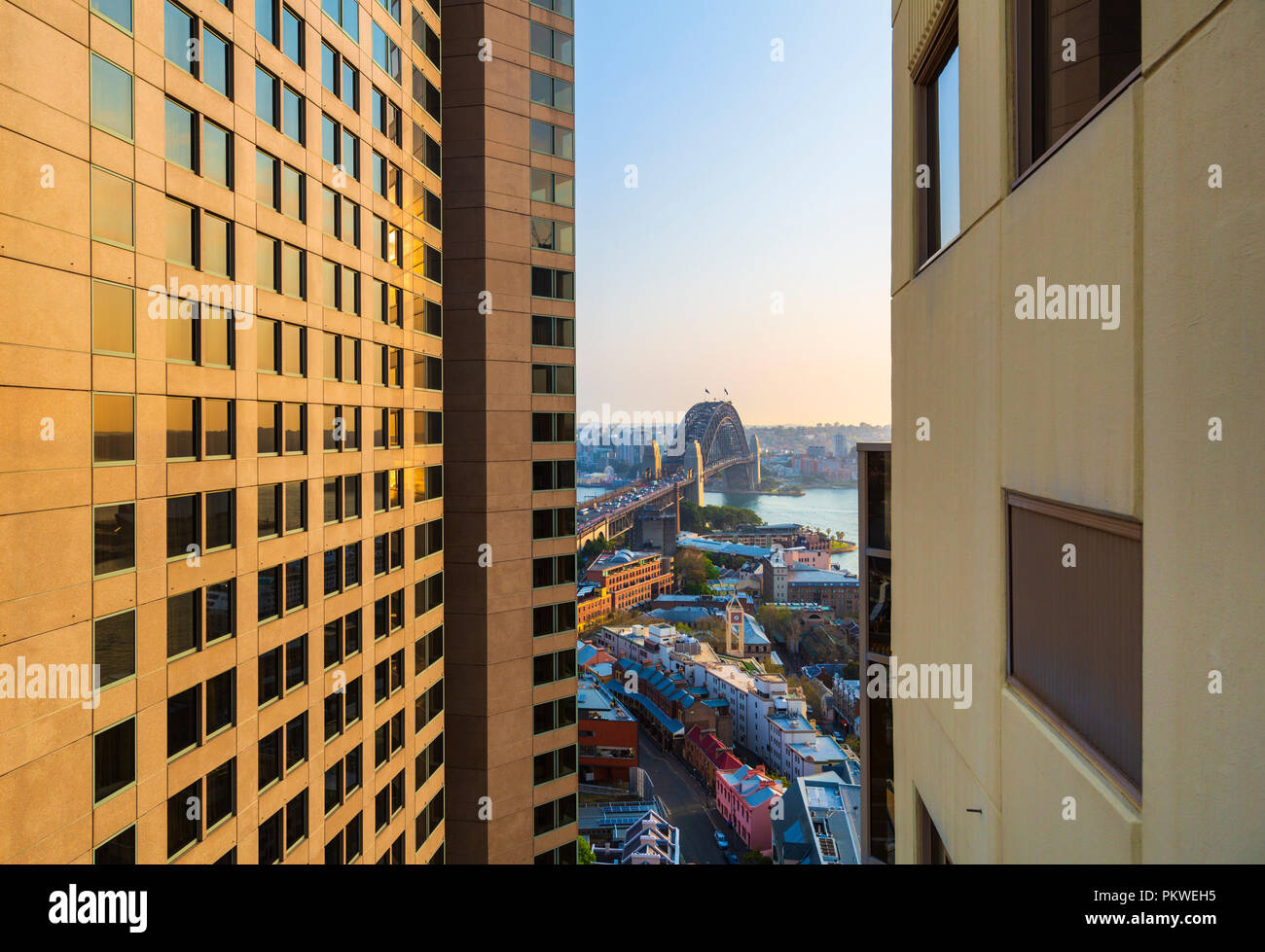 A view of Sydney Harbour Bridge between the buldings of Hotel Quay West and Shangri-La Hotel. The Rocks, Sydney, New South Wales Stock Photo