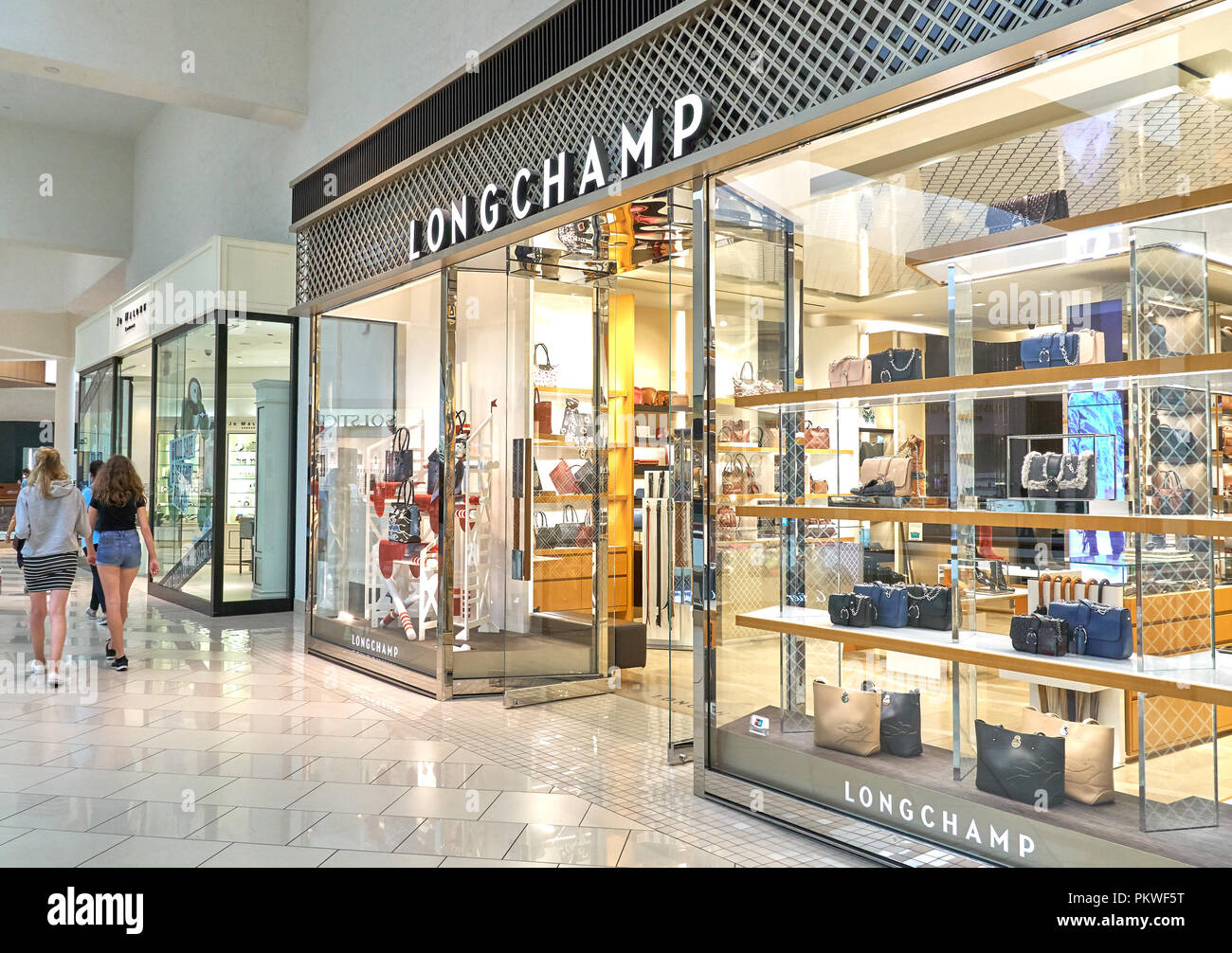 AVENTURA, USA - AUGUST 23, 2018: Longchamp famous boutique in Aventura Mall. Longchamp is a French luxury leather goods company, founded by Jean Casse Stock Photo