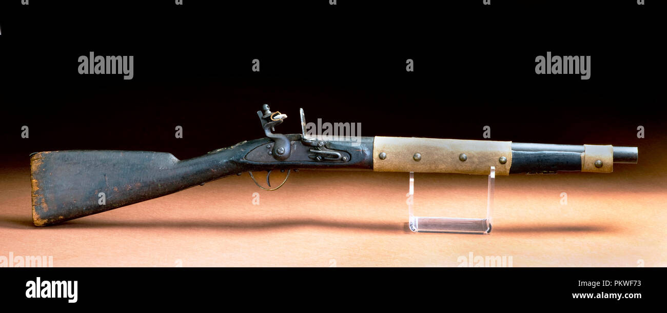American flintlock rifle made around 1840 and used by American Indians with buffalo hide repair. Stock Photo