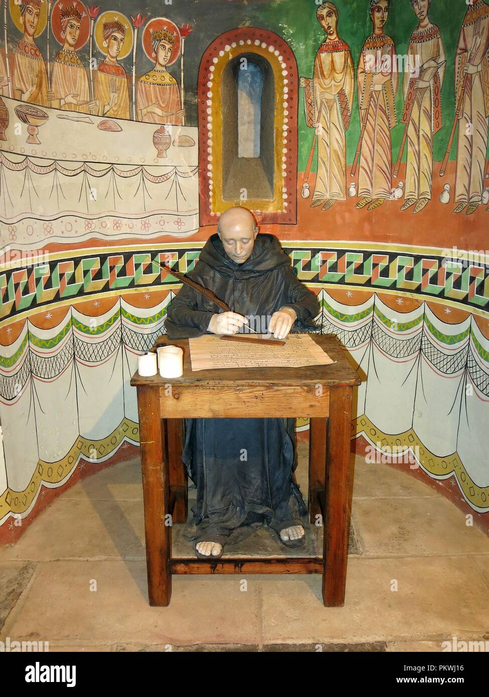 Monk scribe, writing a religious document. Exhibition concerning religion, Montjuic, Barcelona, Spain. Stock Photo