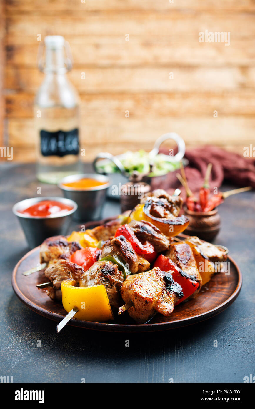 meat kebab with vegetables on plate, fresh kebab with sauce Stock Photo