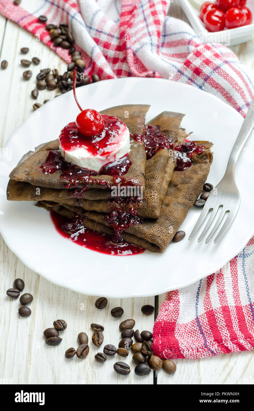 Chocolate pancake with ice cream and raspberry jam Stock Photo Alamy