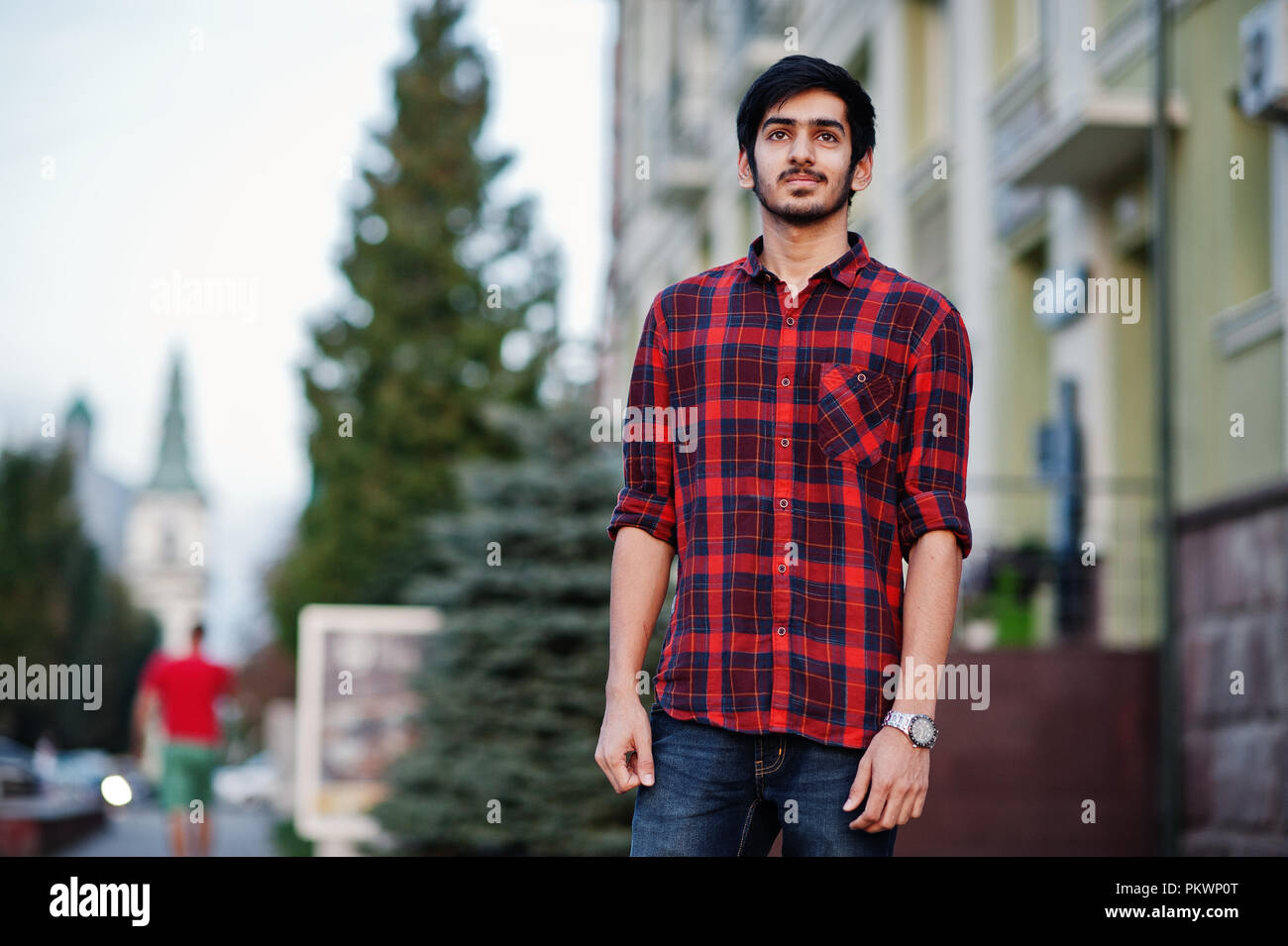 Young indian student man at red 