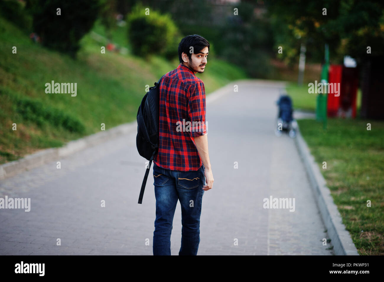 Young indian student man at red 